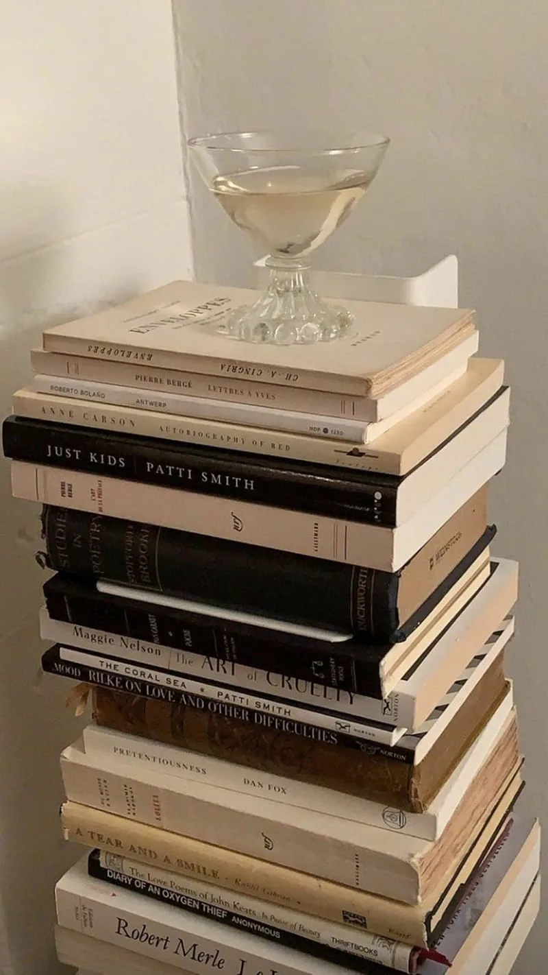 A book club, people with books and glasses of wine
